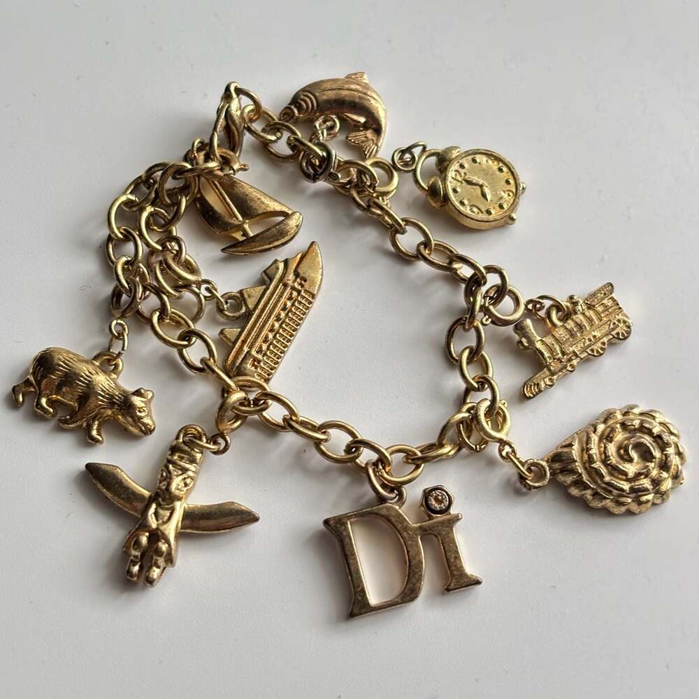 Vintage Gold Tone Charm Bracelet with Travel and Animal Charms